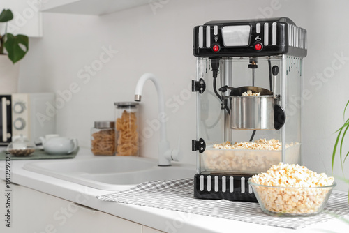 Modern popcorn machine on c...