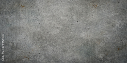 A dark and aged grunge concrete wall texture features a rough gray cement surface with a dirty vintage pattern, creating a blank stone backdrop for a textured industrial design