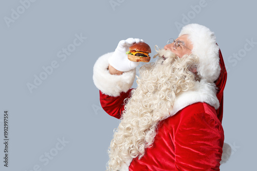 Santa Claus eating tasty bu...