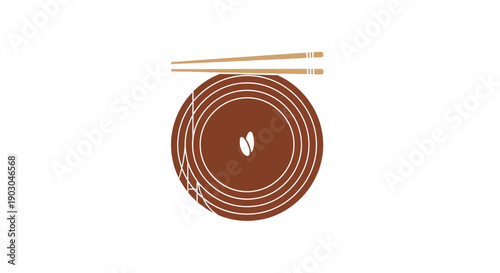 A close-up view of a brown coiled mat with two chopsticks resting on top, set against a clean white background.