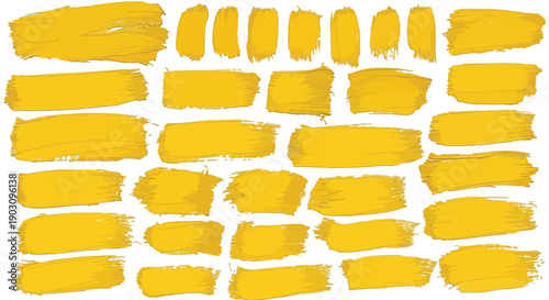 Collection of vibrant yellow brush strokes in various shapes and sizes  perfect for artistic and design projects