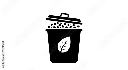 Black and white icon of a trash can with organic waste and a leaf symbol