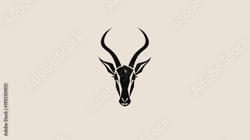 Minimalist silhouette of antelope head on beige background for design