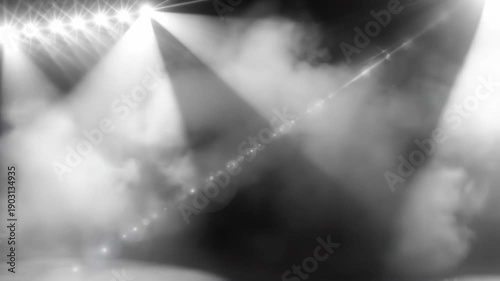 Bright stage lights illuminate the empty stage, creating a dramatic and captivating atmosphere for performance.