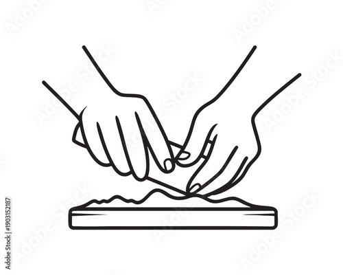 Hands Shaping Clay on Board