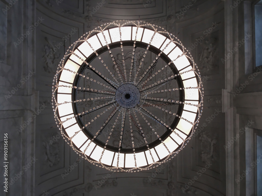 Fototapeta premium Breathtaking architecture details of panoramic dome columns scenic building interior view with historic walls, chandeliers, brass railings, marble statues in public city hall landmark