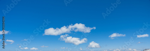 Canvas Print Minimal blue sky with few white clouds creating a clean and peaceful background