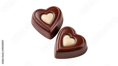 Photos Two heart-shaped chocolate candies sit side by side  isolated on transparent bac