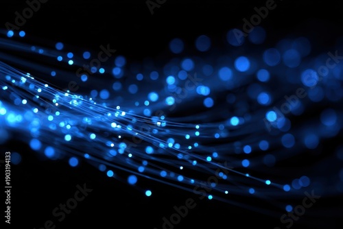 Blue glowing optical fiber lines with shimmering bokeh on dark. Perfect for high-speed data, networking, and digital communication.
