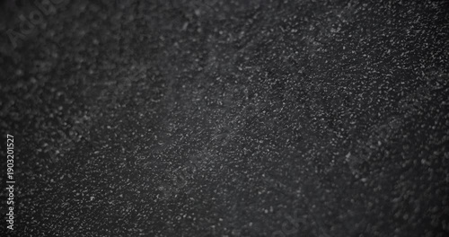 Slow diagonal shift of the background with asphalt texture and steam effect.