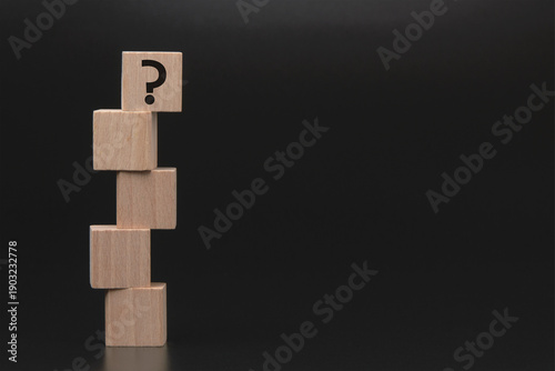 Bilde på lerret Question mark on wooden blocks representing uncertainty and decision making
