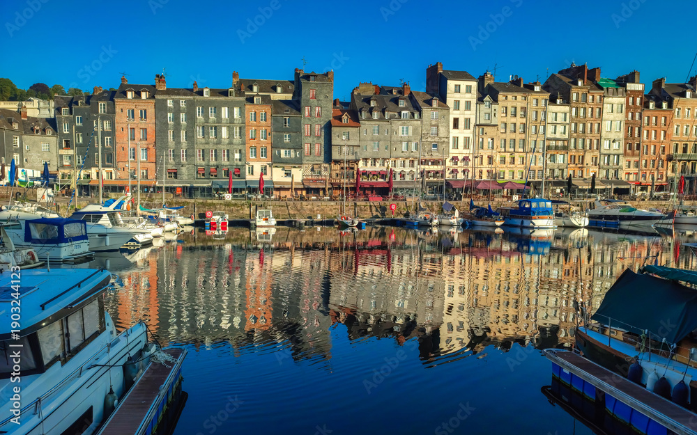 Fototapeta premium Sunset scenery in beautiful town of Honfleur in France with a little harbor