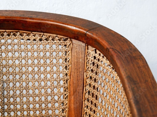 Photos Close-up of vintage wooden chair with traditional cane webbing texture
