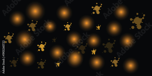 Vibrant gold splatters on black background with glowing bokeh lights