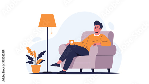 Relaxed man sits in a comfortable armchair at home while holding a cup of hot coffee and enjoying a peaceful moment of rest.