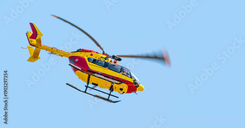 Flying EC 145 helicopter