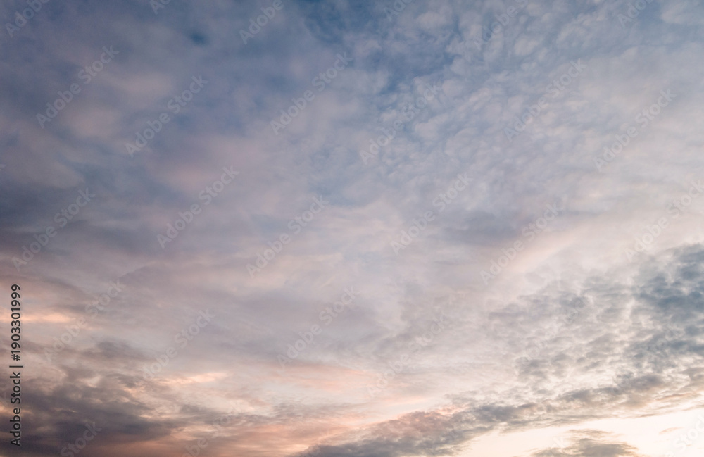 Obraz premium Panoramic view of sunset golden and blue sky nature background. Colorful dramatic sky with cloud at sunset.Sky background.Sky with clouds at sunset.