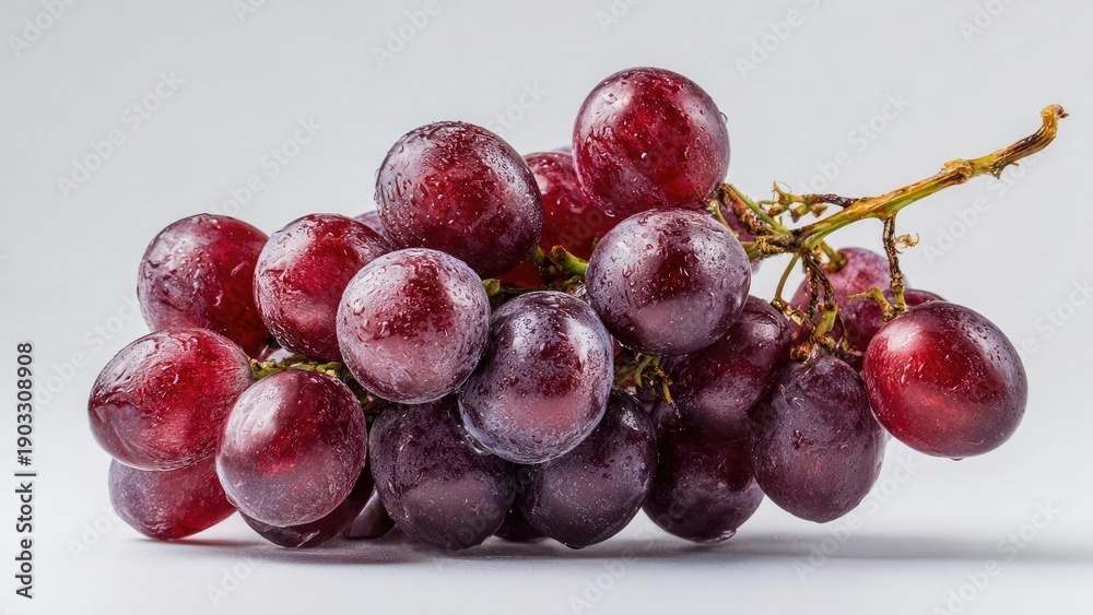 Obraz premium A bunch of red and purple grapes with frost on their skins. Concept Frosty red and purple grapes, Winter still life, Close-up of frosted grape skins, Rich red-purple color palette