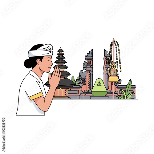 Balinese man praying in front of a Hindu temple