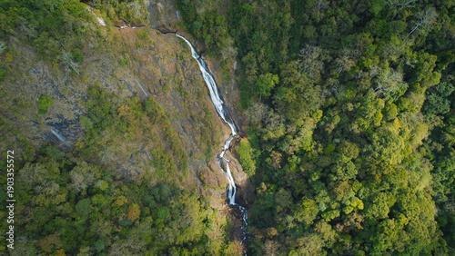 Wallpaper Mural Tall segmented waterfall cascading down rocky cliff face in evergreen forest of Costa Rica. Torontodigital.ca