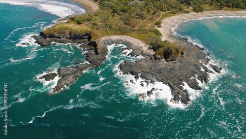 Wallpaper Mural Aerial view of rocky peninsula with ocean waves crashing on Costa Rican coast. Torontodigital.ca