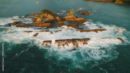 Wallpaper Mural Waves breaking over rocky island with palm trees in tropical ocean. Torontodigital.ca