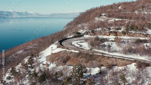 Winding mountain road aerial view in winter