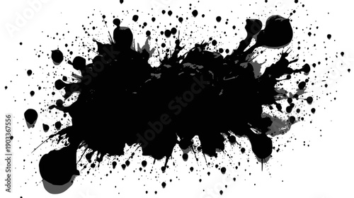 A man sits outdoors near rail tracks with trees behind, wearing a white shirt featuring a motor racing symbol,