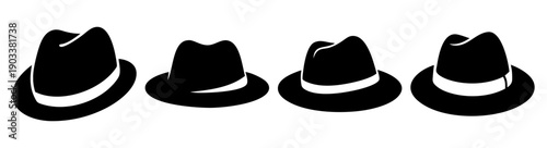 Four black fedoras hats flat lay minimalist top view fashion accessories collection