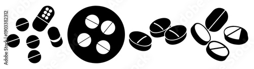 Assortment of black and white pills and capsules scattered on dark background for medical health concept