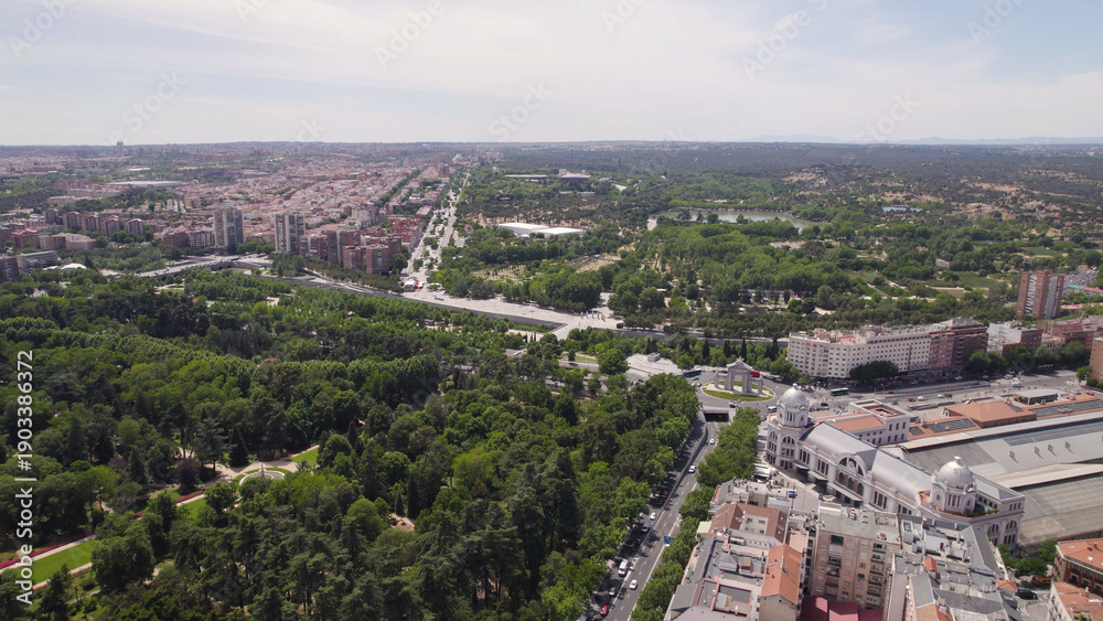 Fototapeta premium Aerial Drone View of Campo del Moro Gardens, San Vicente Gate, and Príncipe Pío Station, Madrid, Spain