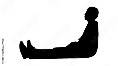 Silhouette of person sitting and leaning back