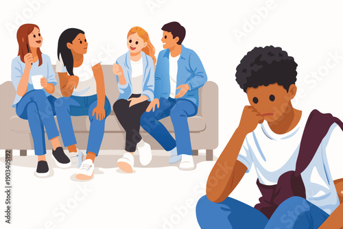 Young man sitting on the floor looking sad while his friends talk in the background.