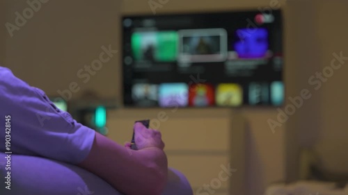 Relaxing on Sofa Watching Streaming TV with Remote