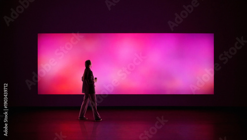 Quadro su tela Vibrant artwork woman observing glowing abstract color panel