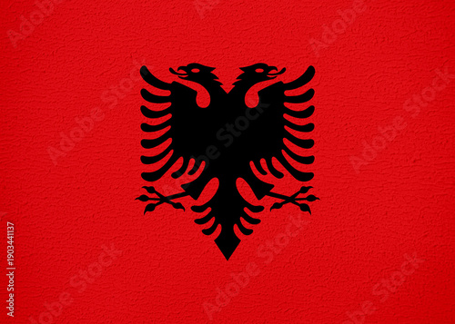 Albania Flag with Wall Texture Background