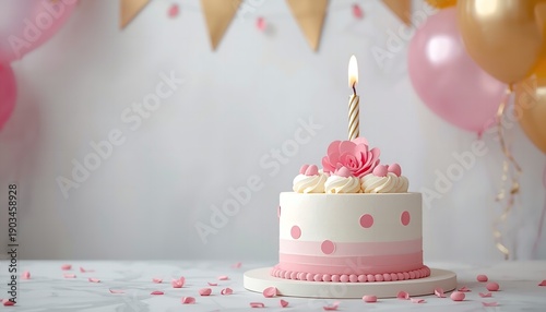 Elegant pink and white birthday cake with burning candle and balloons on light background for celebration greeting card