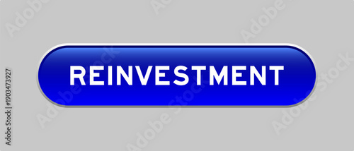 Blue color capsule shape button with word reinvestment on gray background