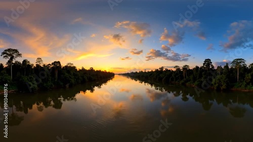 River at sunset with forest background.