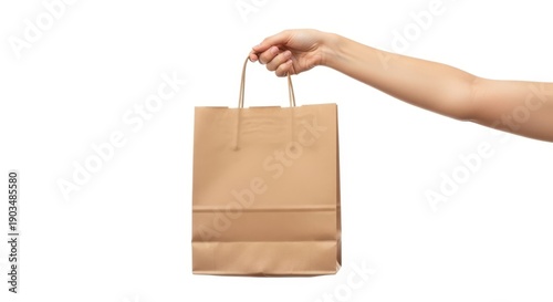 Hand holding brown paper bag isolated on white background