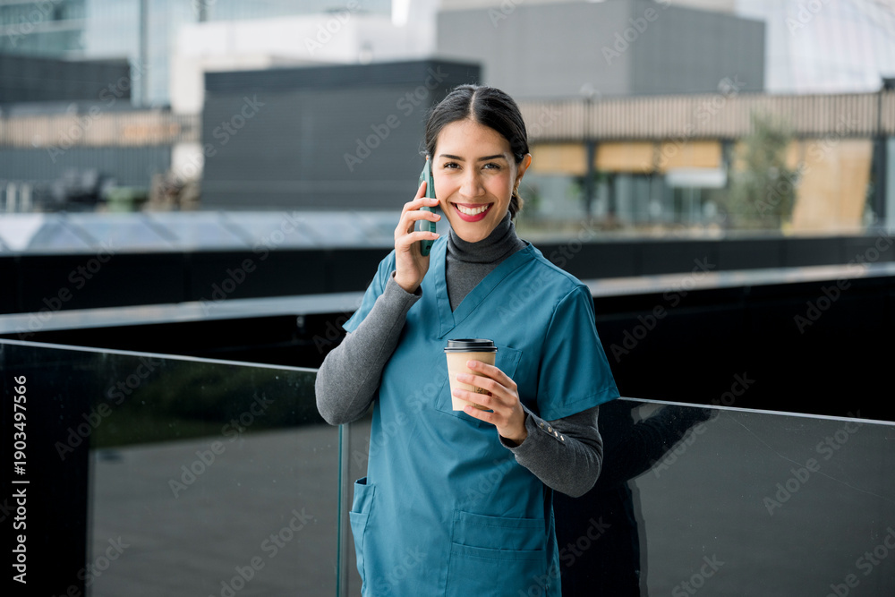 Fototapeta premium Healthcare professional talking on phone during break