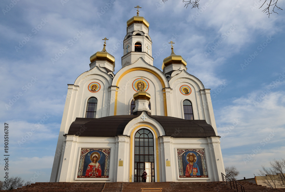 Fototapeta premium Plast, Russia - November 15, 2025: A woman enters the Orthodox Church of the Holy Great Martyr Barbara