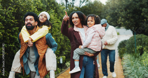 Fotografía Family, children and walk at park, happy and piggy back with point for sightseeing, holiday and bonding