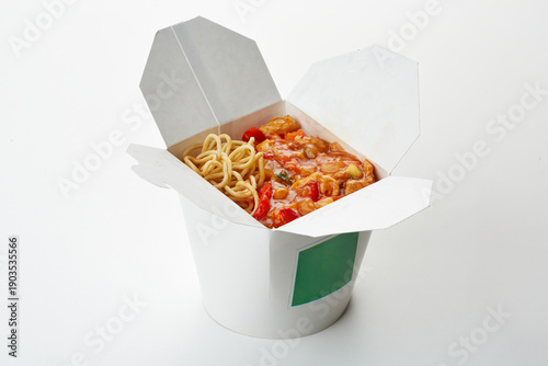 Fotografie Chinese take-out food box with noodles and sweet sour chicken
