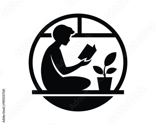 Silhouette of a person reading a book next to a potted plant on a windowsill inside a circular frame