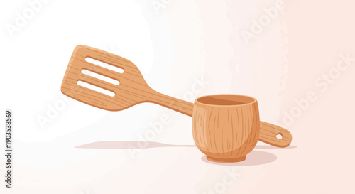 Wooden spatula rests across a carved wooden mug on a light background
