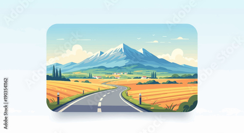 Winding road through golden fields towards majestic snow-capped mountains