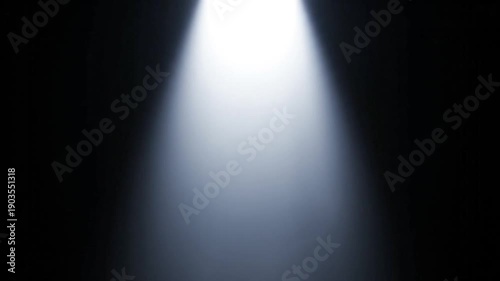 Moving stage lightbeam effect. Dynamic light rays in darkness. Abstract light projection for performance or product display.