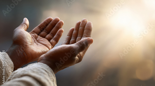 Muslim hands raised in prayer with divine light spiritual worship faith dua islamic religious content use