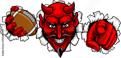 A devil man holding American football ball, breaking through the background and pointing sports team mascot illustration.